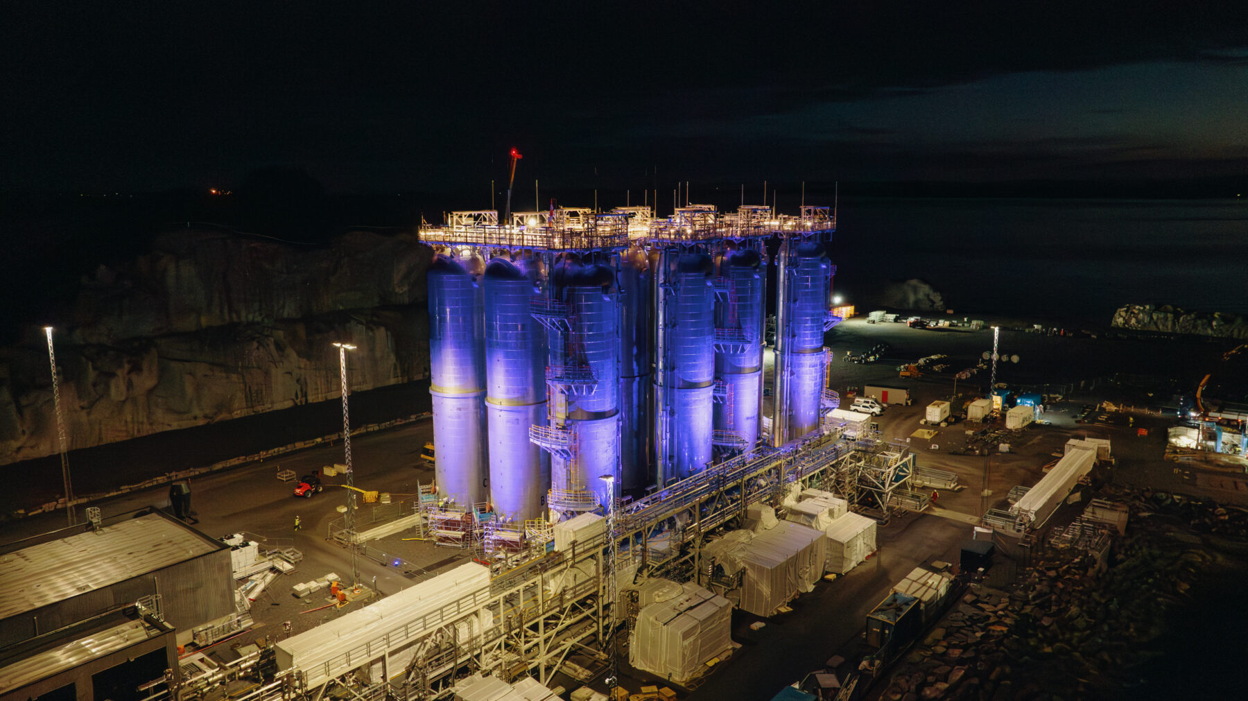 Northern Lights storage tanks at night – photo by Screen Story